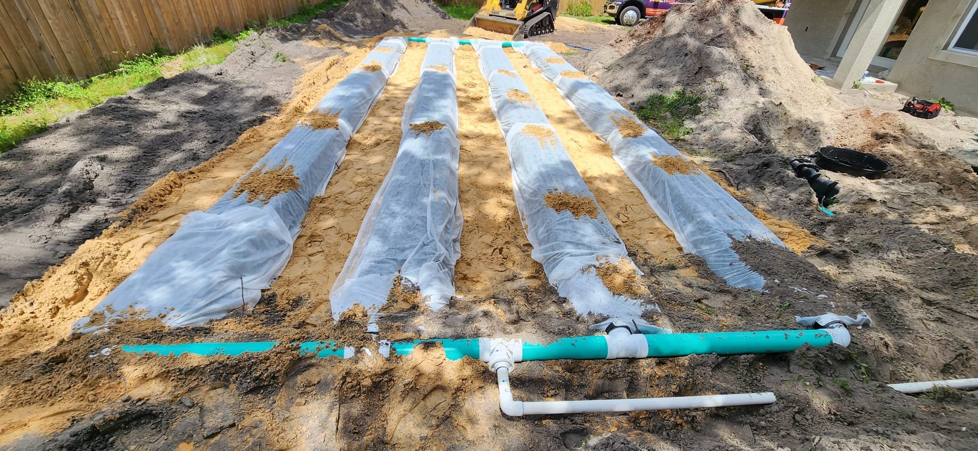 An exposed drain field on top of septic sand used for filtering wastewater.