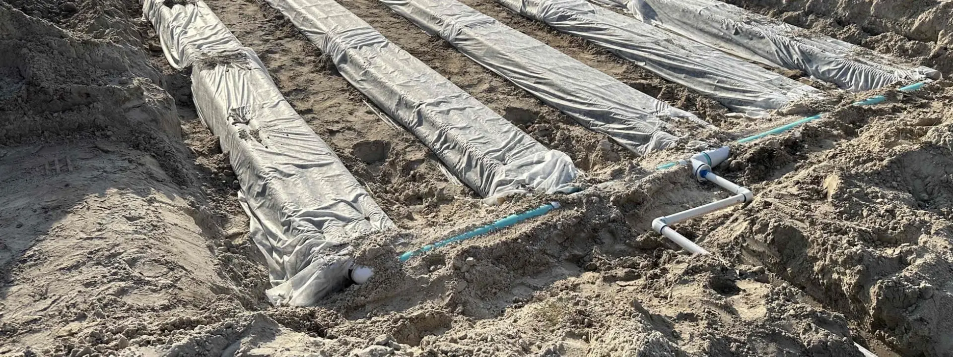 A close up image of a new drainfield being installed.
