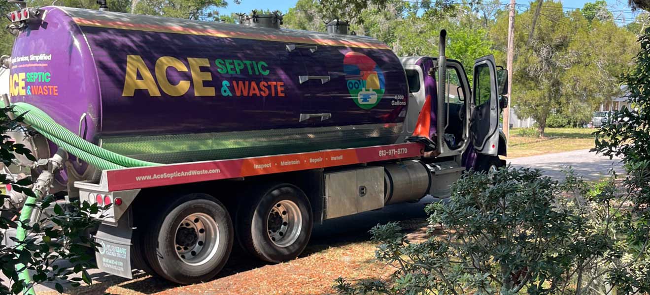 Lakeland septic tank pumping company, ACE Septic & Waste has a truck parked outside a customer’s home while perform septic tank cleaning.