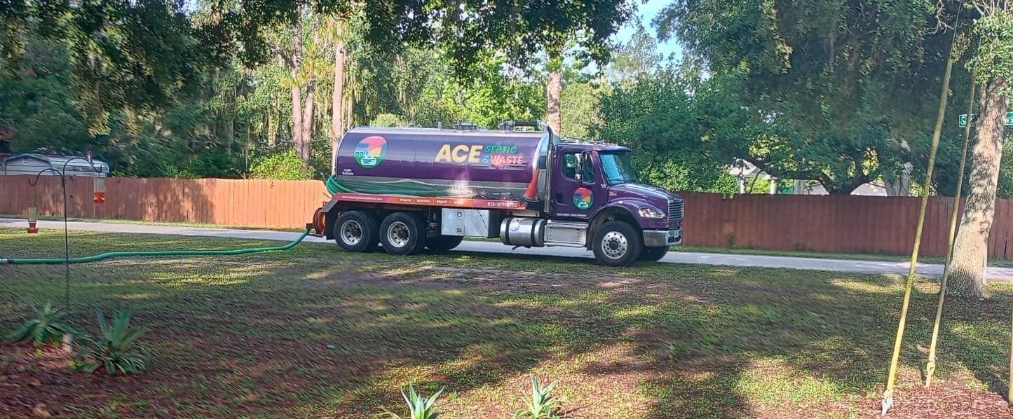 A septic tank pump truck starting a residential job in Spring Hill.