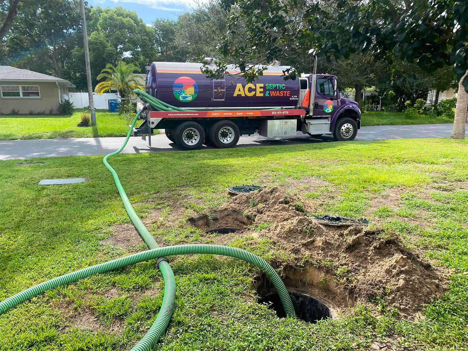 A septic pump truck being used to service a home in Plant City, FL.