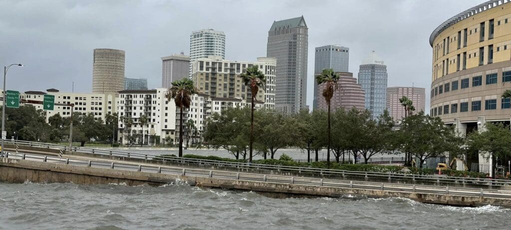 Flooding from Helene affects the roads and city, requiring pumping and draining.