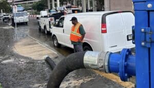 A septic worker helping to remove storm water from Tampa streets.