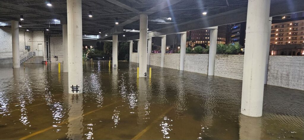 A parking garage flooded with water from Hurricane Helene.