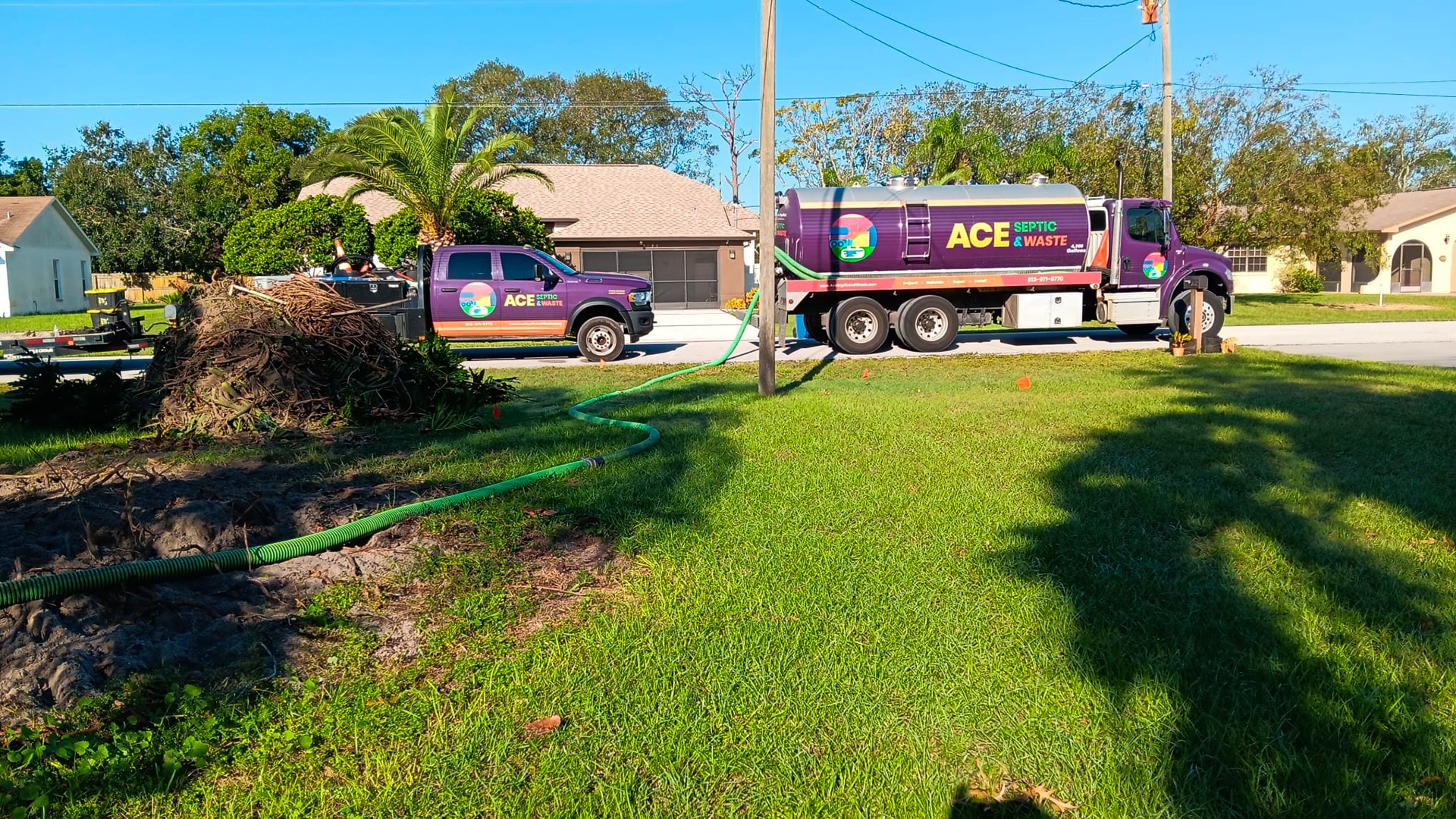 A septic pump truck and a trailer with materials for a septic system installation in Pinellas County, FL.