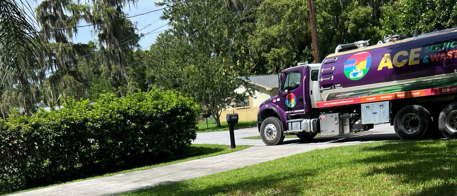 A septic pump truck parked and ready to begin pumping a residential septic system in Winter Haven, FL.